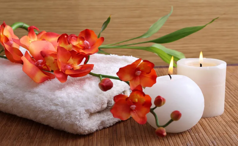 Spa towels, candles, and herbal essentials at ZOYA Spa